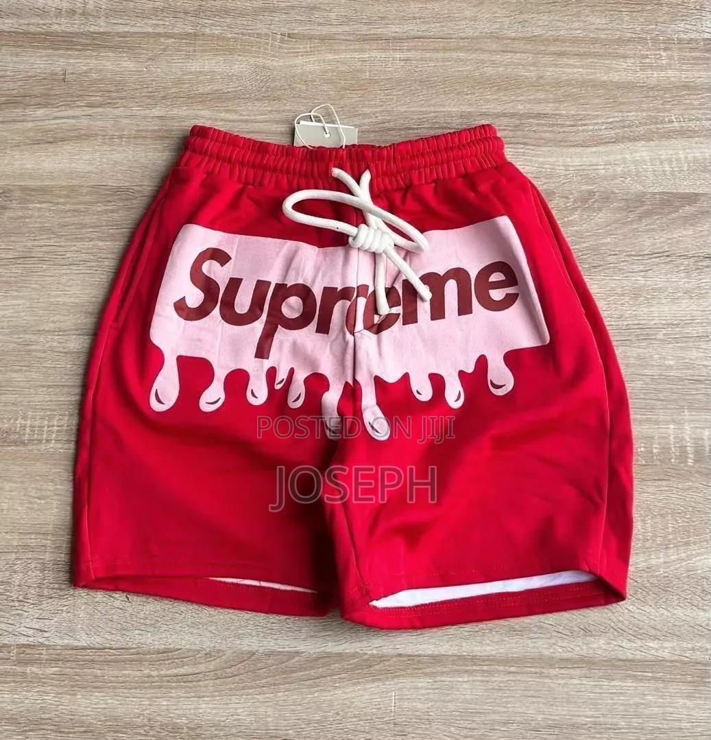 Red Graphic Drawstring Shorts With a Bold Dripping-Style Design