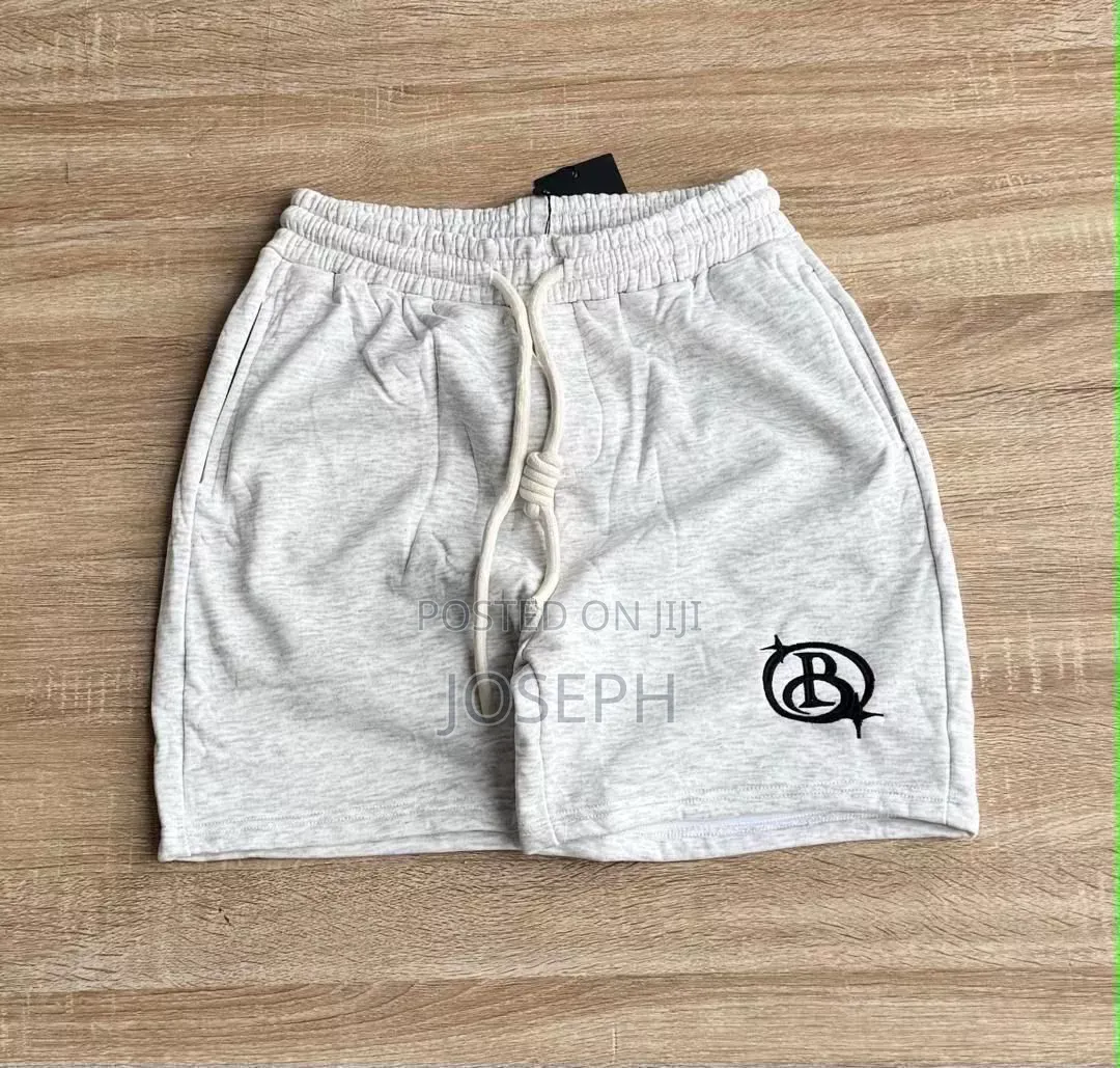 Red Graphic Drawstring Shorts With a Bold Dripping-Style Design