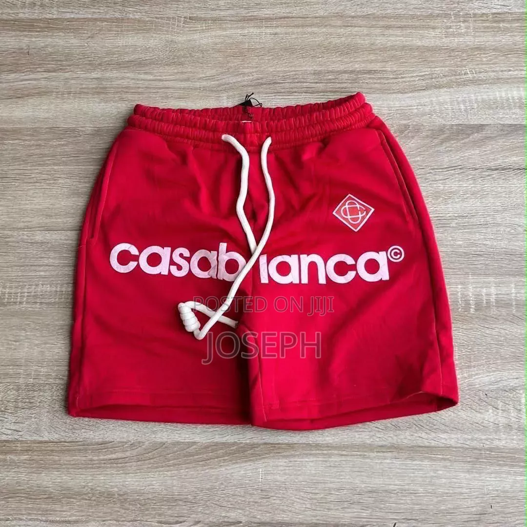 Red Graphic Drawstring Shorts With a Bold Dripping-Style Design
