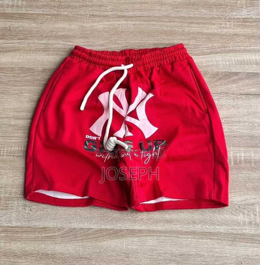 Red Graphic Drawstring Shorts With a Bold Dripping-Style Design