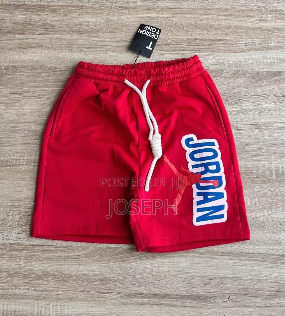 Red Graphic Drawstring Shorts With a Bold Dripping-Style Design