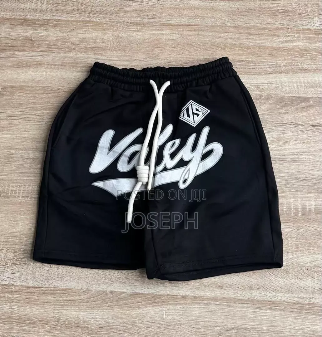 Red Graphic Drawstring Shorts With a Bold Dripping-Style Design