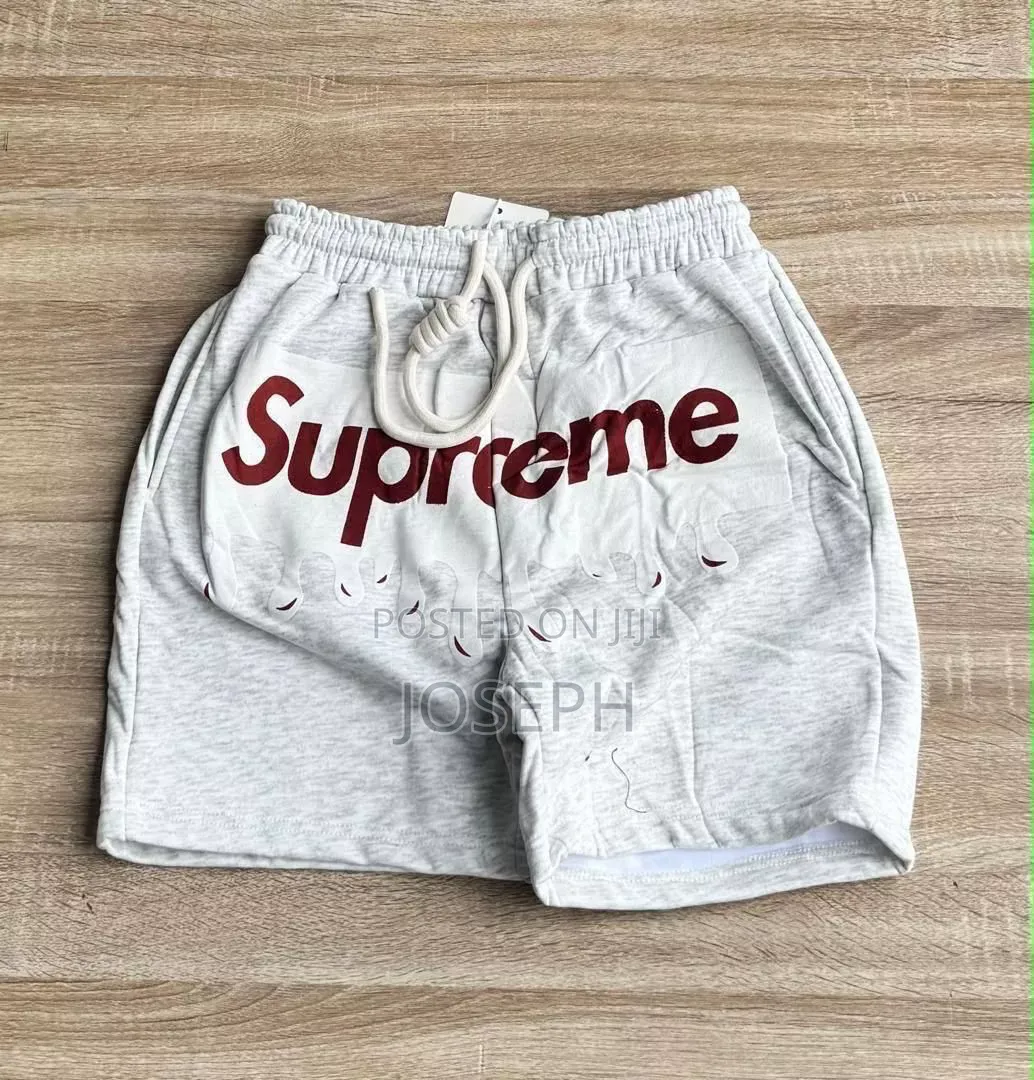 Red Graphic Drawstring Shorts With a Bold Dripping-Style Design