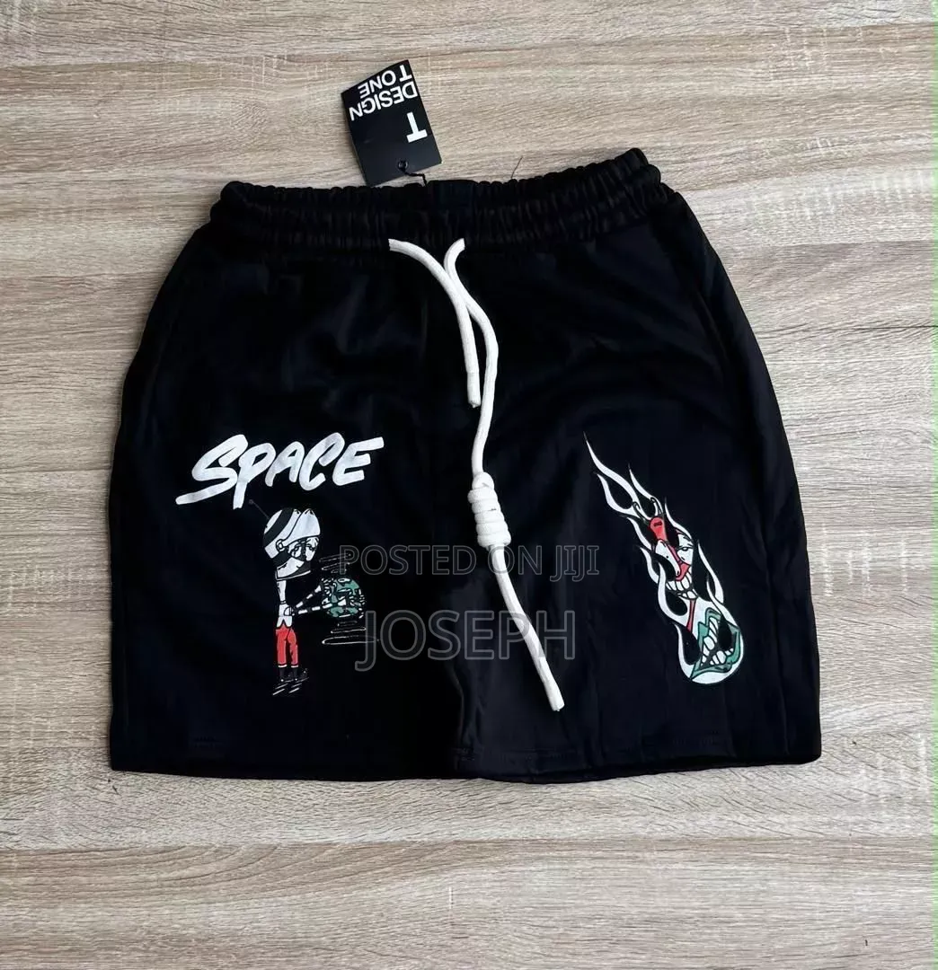 Red Graphic Drawstring Shorts With a Bold Dripping-Style Design