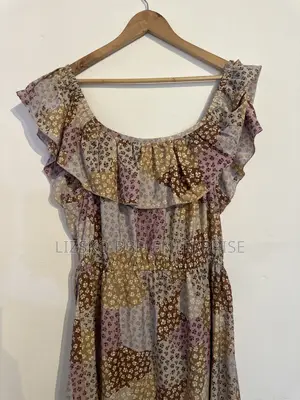 Flowy Midi Dress Featuring a Multi-Pattern Floral Print
