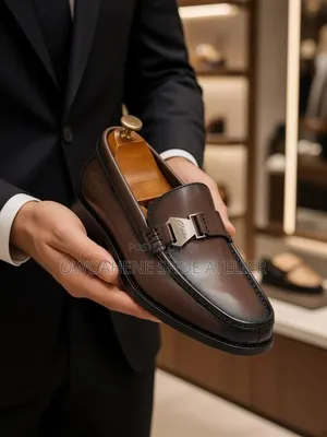 Clarks Brown Leather Strap Loafers.
