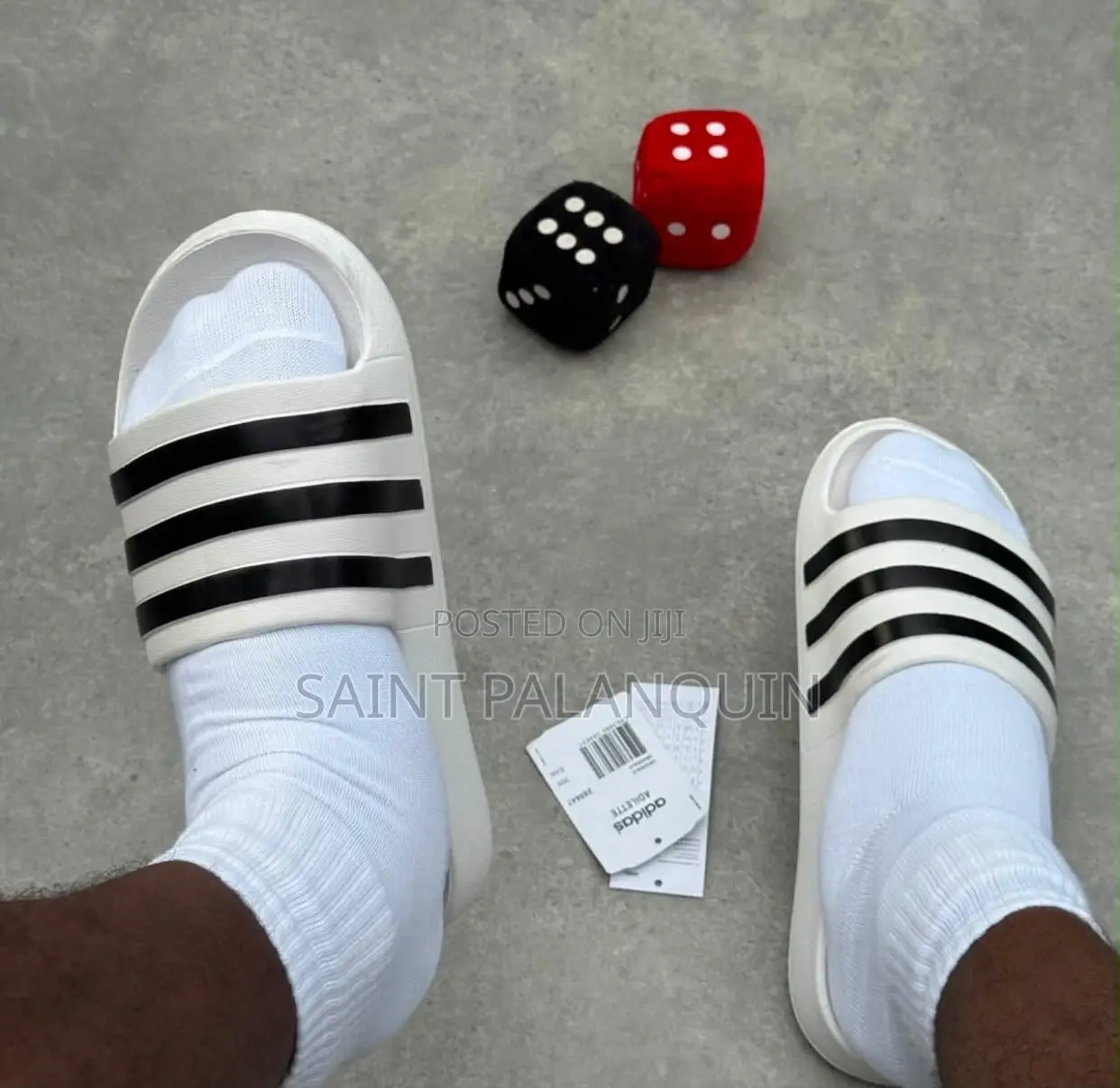 These Are the White Adidas Slide Sandals Three Distinct Black Stripes