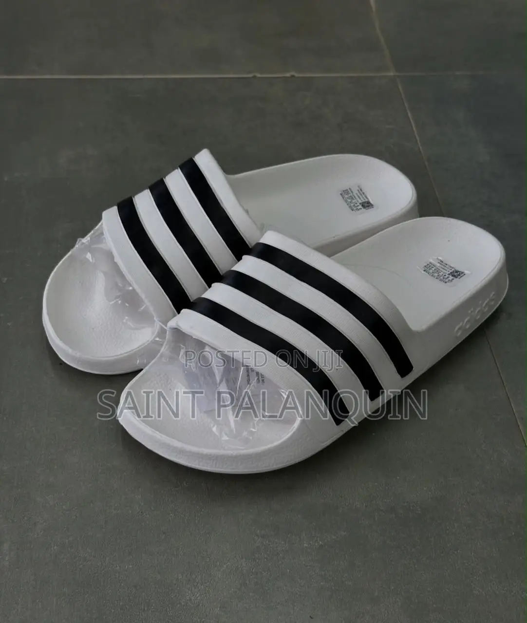 These Are the White Adidas Slide Sandals Three Distinct Black Stripes