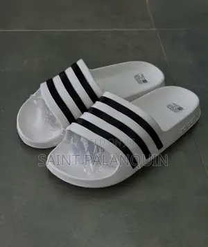 These Are the White Adidas Slide Sandals Three Distinct Black Stripes
