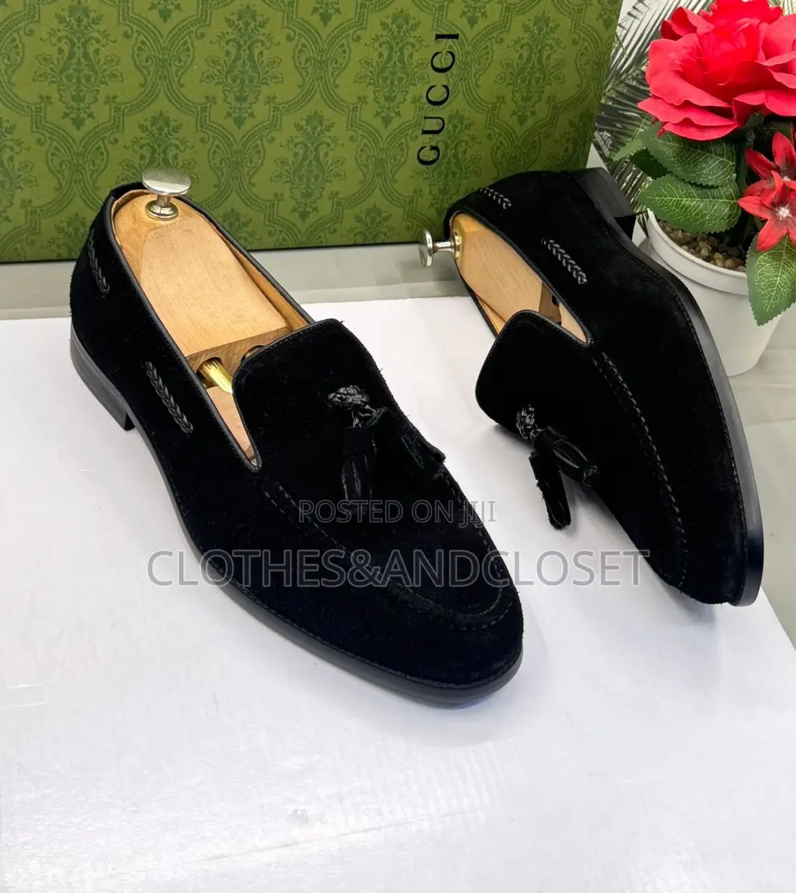 A Pair of Men's Black Suede Tassel Loafers