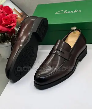 Dark Brown Leather Clarks Penny Loafers Featuring a Classic Slip-On