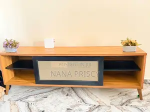 Modern Wooden TV Console With a Black Rattan Center Panel.