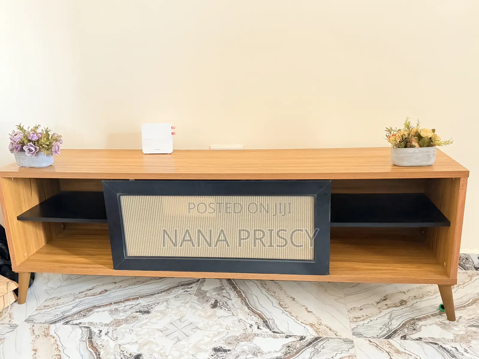 Modern Wooden TV Console With a Black Rattan Center Panel.