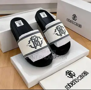 The Image Shows a Pair of Black and White Roberto Cavalli Slides