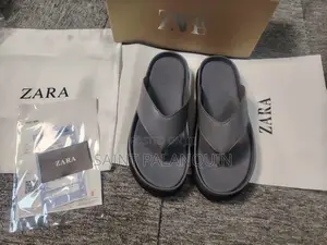 The Image Displays a Pair of Gray Platform Thong Sandals