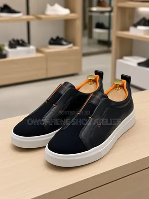 The Selected Item Is a Pair of Santoni Laceless Leather Slip-on Snea