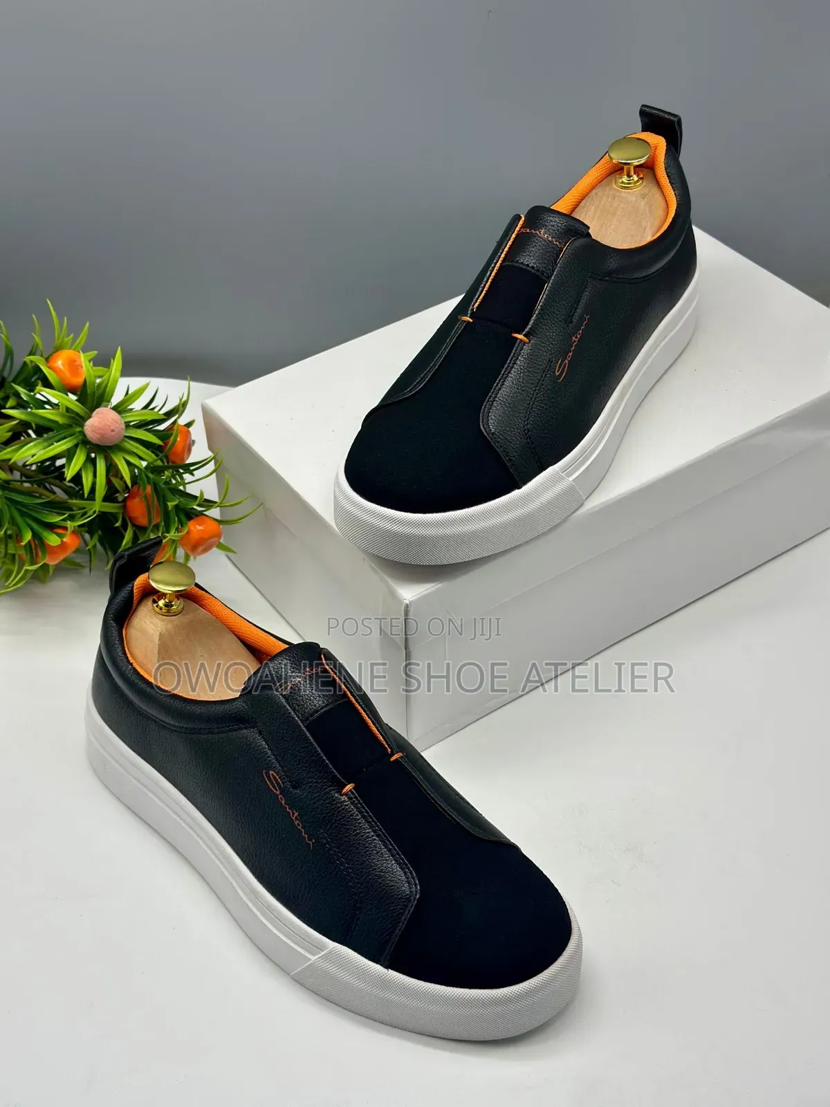 The Selected Item Is a Pair of Santoni Laceless Leather Slip-on Snea