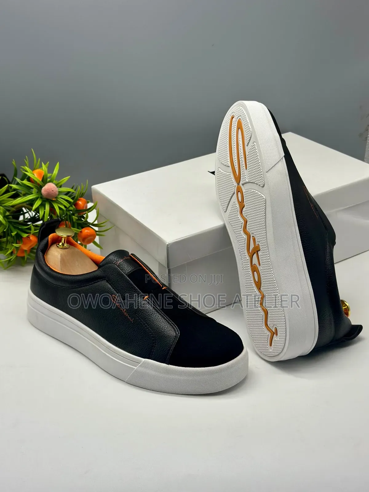The Selected Item Is a Pair of Santoni Laceless Leather Slip-on Snea