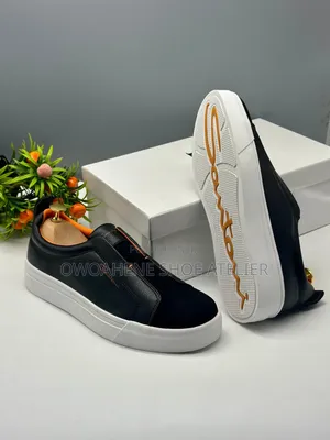 The Selected Item Is a Pair of Santoni Laceless Leather Slip-on Snea