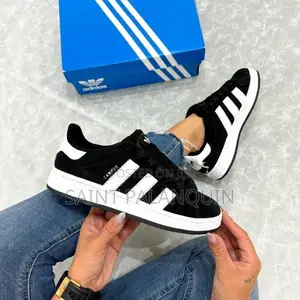 The Image Shows a Pair of Black and White Adidas Campus Sneakers
