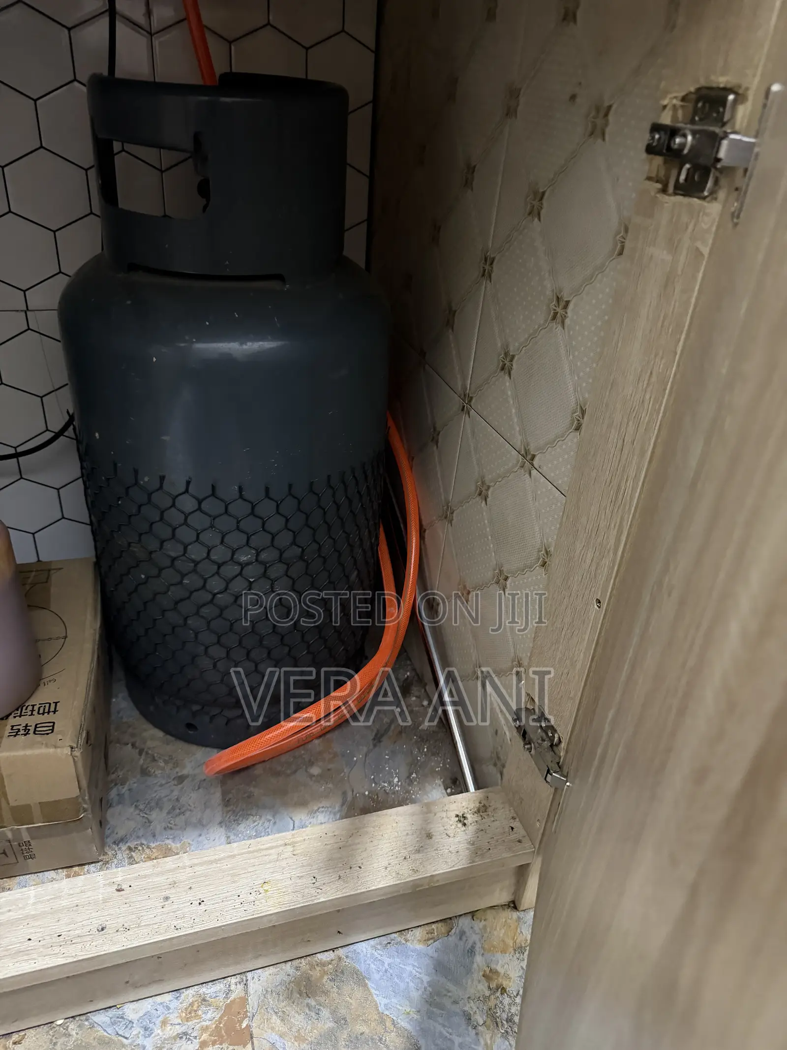 Four Burner but One Is Electrical and Gas Cylinder