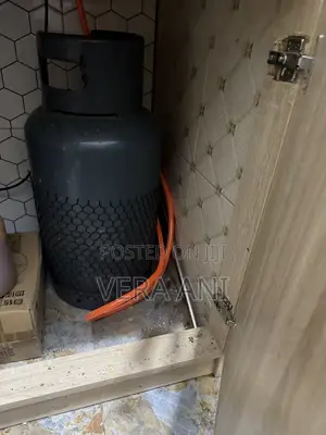 Four Burner but One Is Electrical and Gas Cylinder