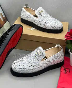 Christian Louboutin Slip-on Loafer Featuringan Intricatecutout Pattern