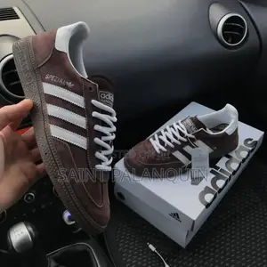 A Pair of Brown and White Adidas Handball Spezial Sneakers