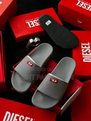 Grey Diesel Slide Sandals Featuring a Small Red "D" Logo on the Strap.