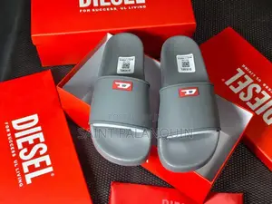 Grey Diesel Slide Sandals Featuring a Small Red "D" Logo on the Strap.