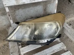 Original 2012 Toyota Vitz HeadLights (Right )