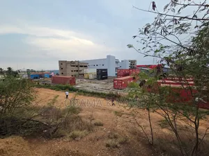Titled Roadside 4.29 Acres With Building for Sale at Main Spintex Road