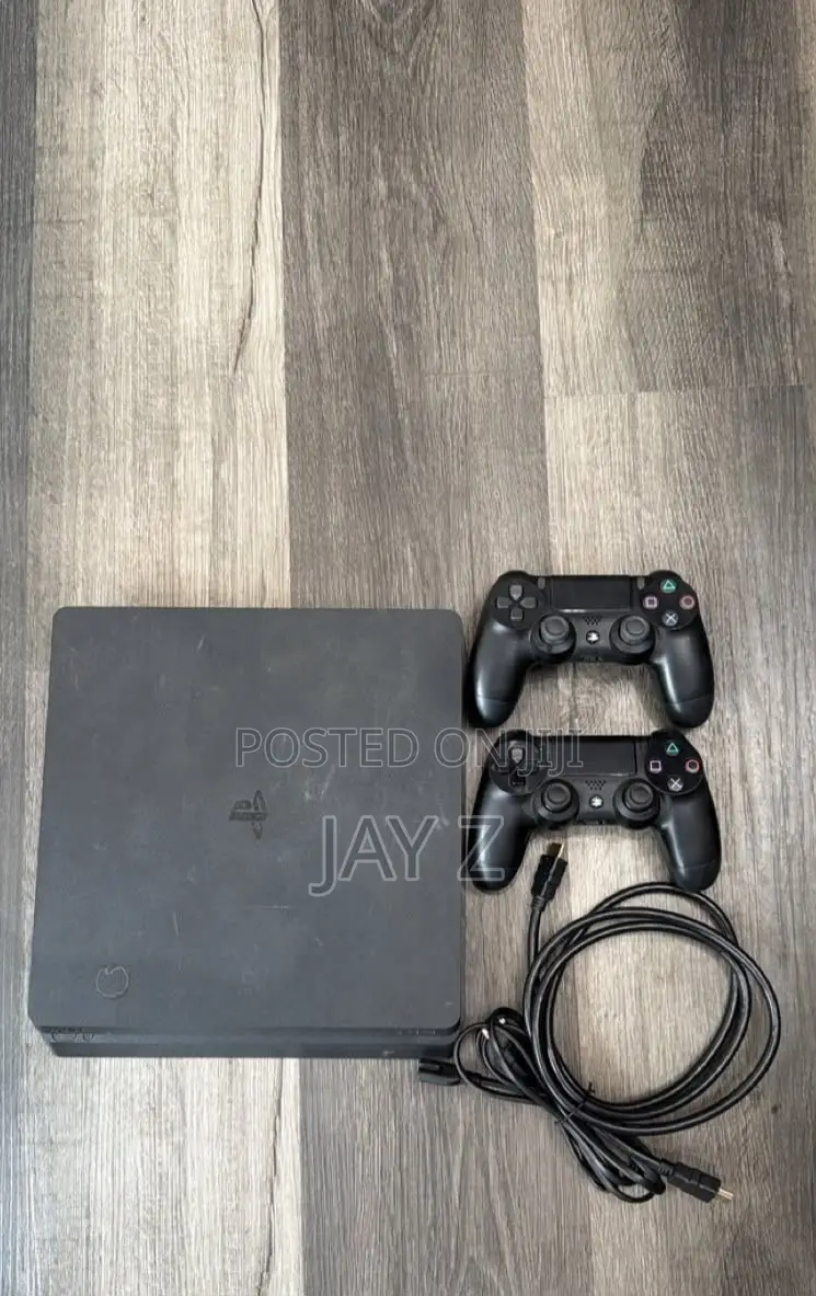 PS4 SLIM 1TB WITH 2 Controllers and a Few Games. No Jailbreak