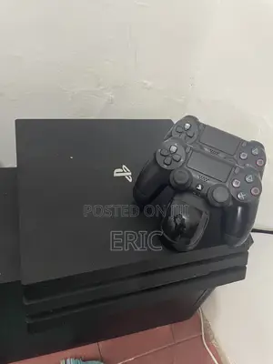 PS 4 Pro With All the Cables 2 Pads With a Charging Pot