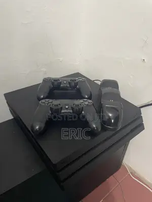 PS 4 Pro With All the Cables 2 Pads With a Charging Pot