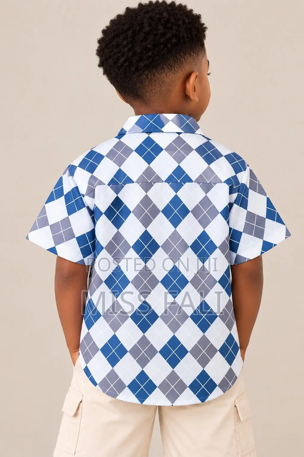 Blue Argyle Shirt. 6-7Years