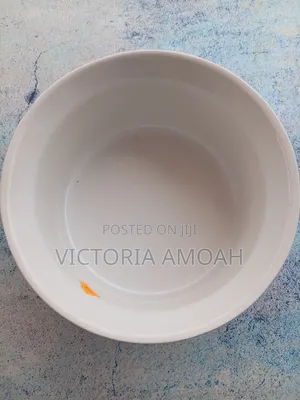 A Glossy Blue Ceramic Ramekin.
