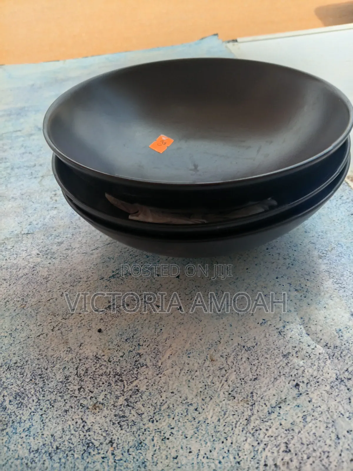 A Black Ceramic Shallow Bowl.