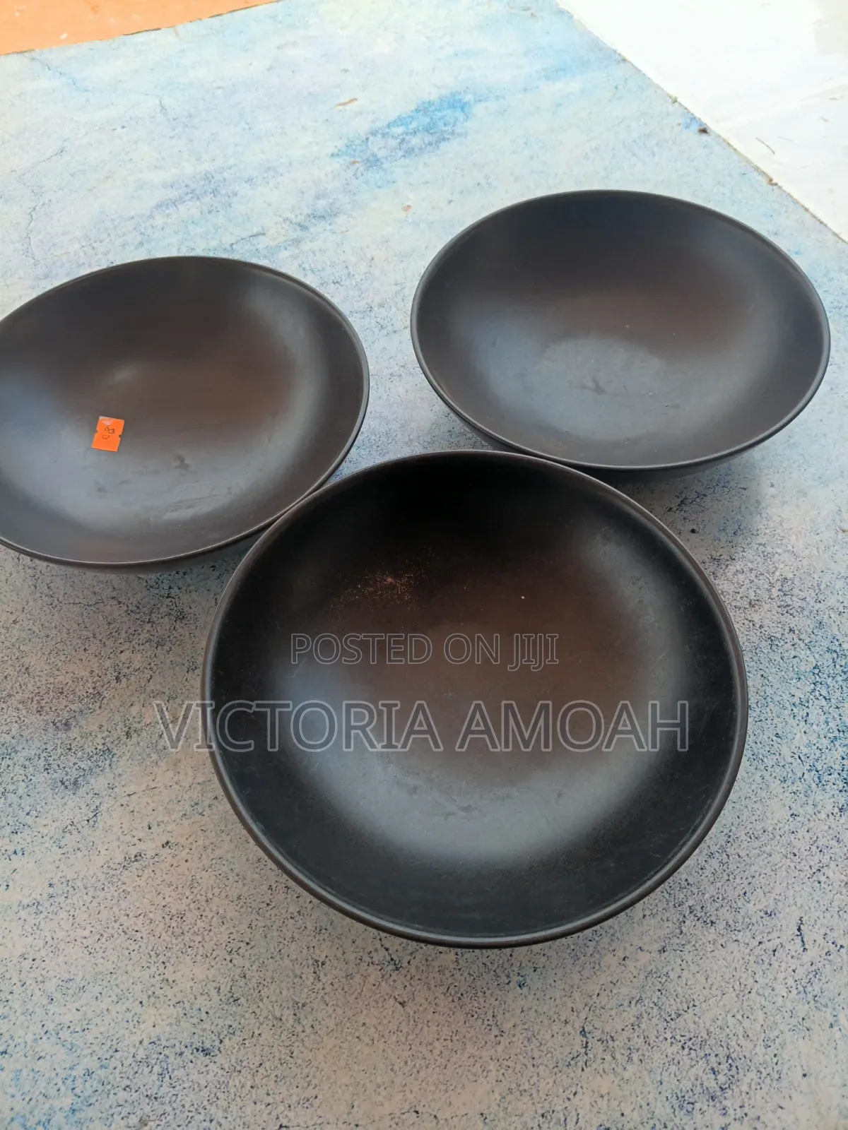A Black Ceramic Shallow Bowl.