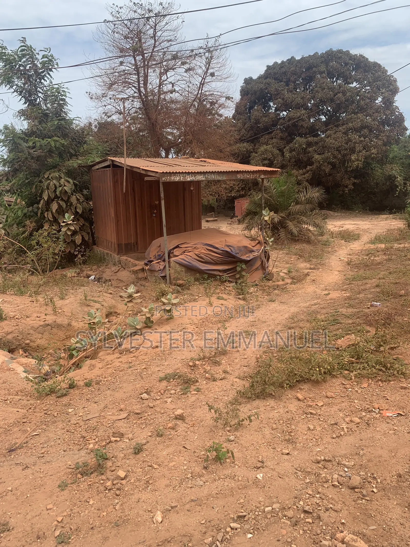 A Plot of Land (70/100 ) at Aplaku on a Roadside With a Building