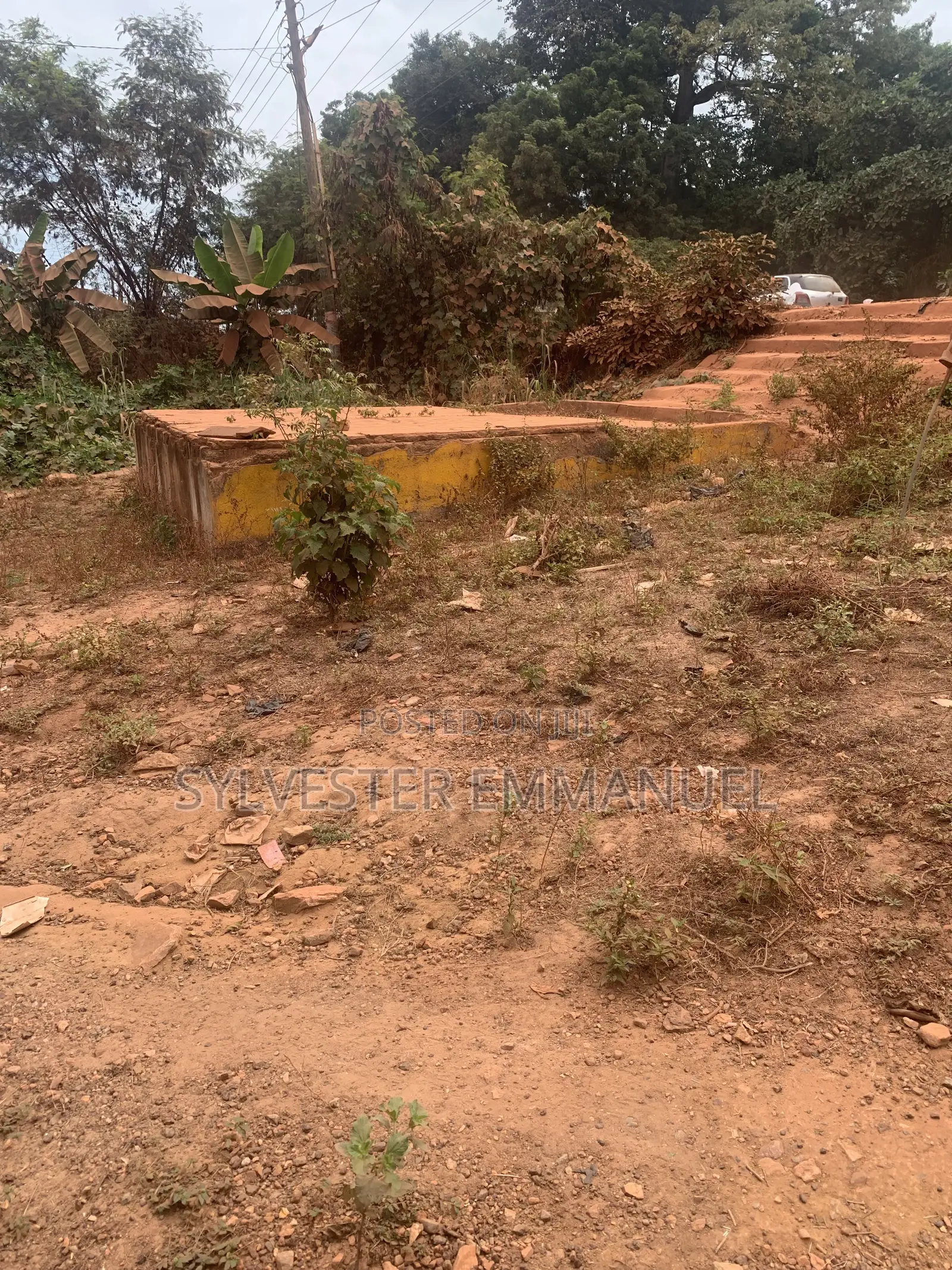 A Plot of Land (70/100 ) at Aplaku on a Roadside With a Building
