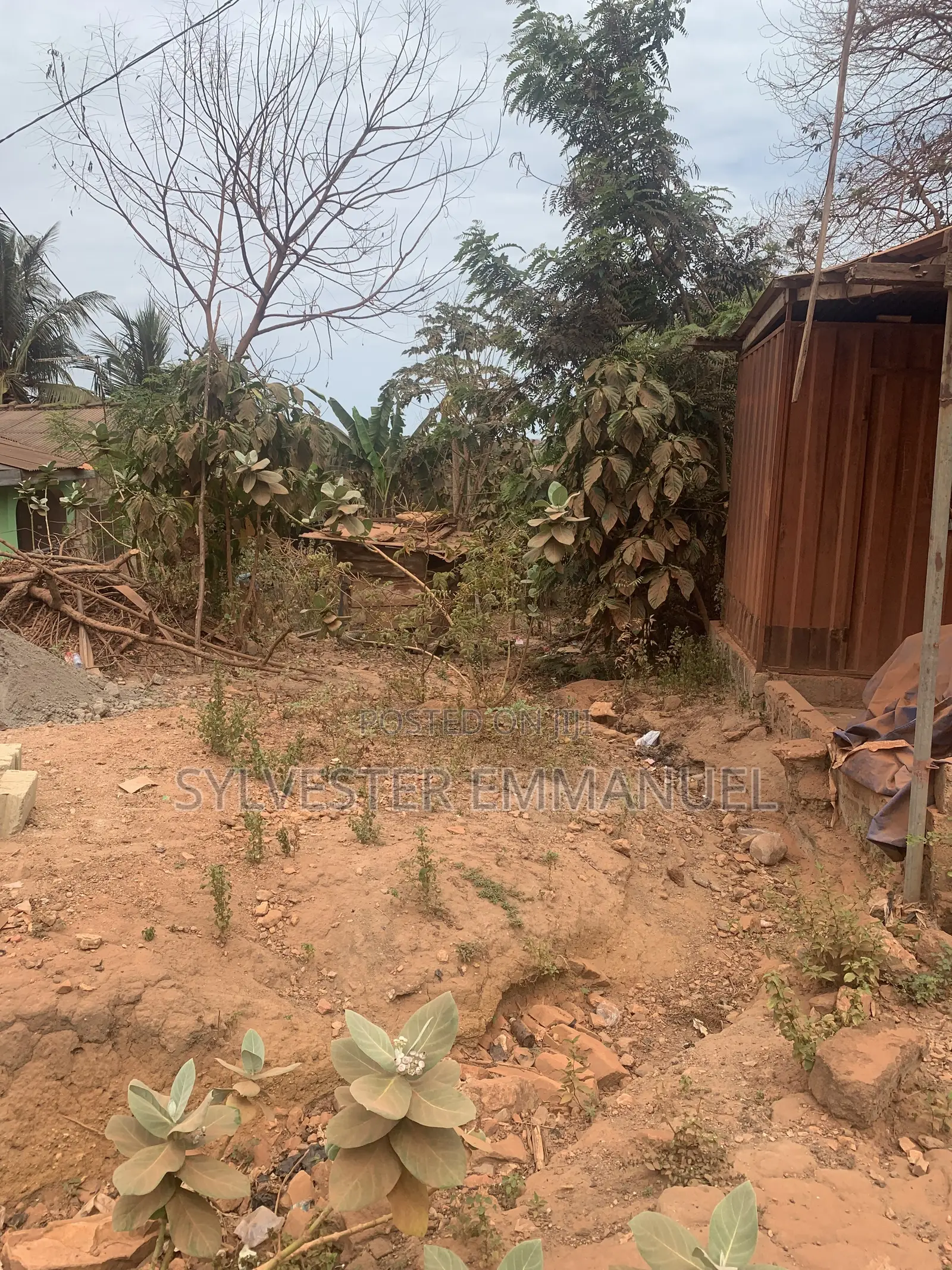A Plot of Land (70/100 ) at Aplaku on a Roadside With a Building