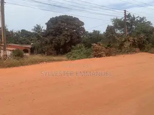A Plot of Land (70/100 ) at Aplaku on a Roadside With a Building