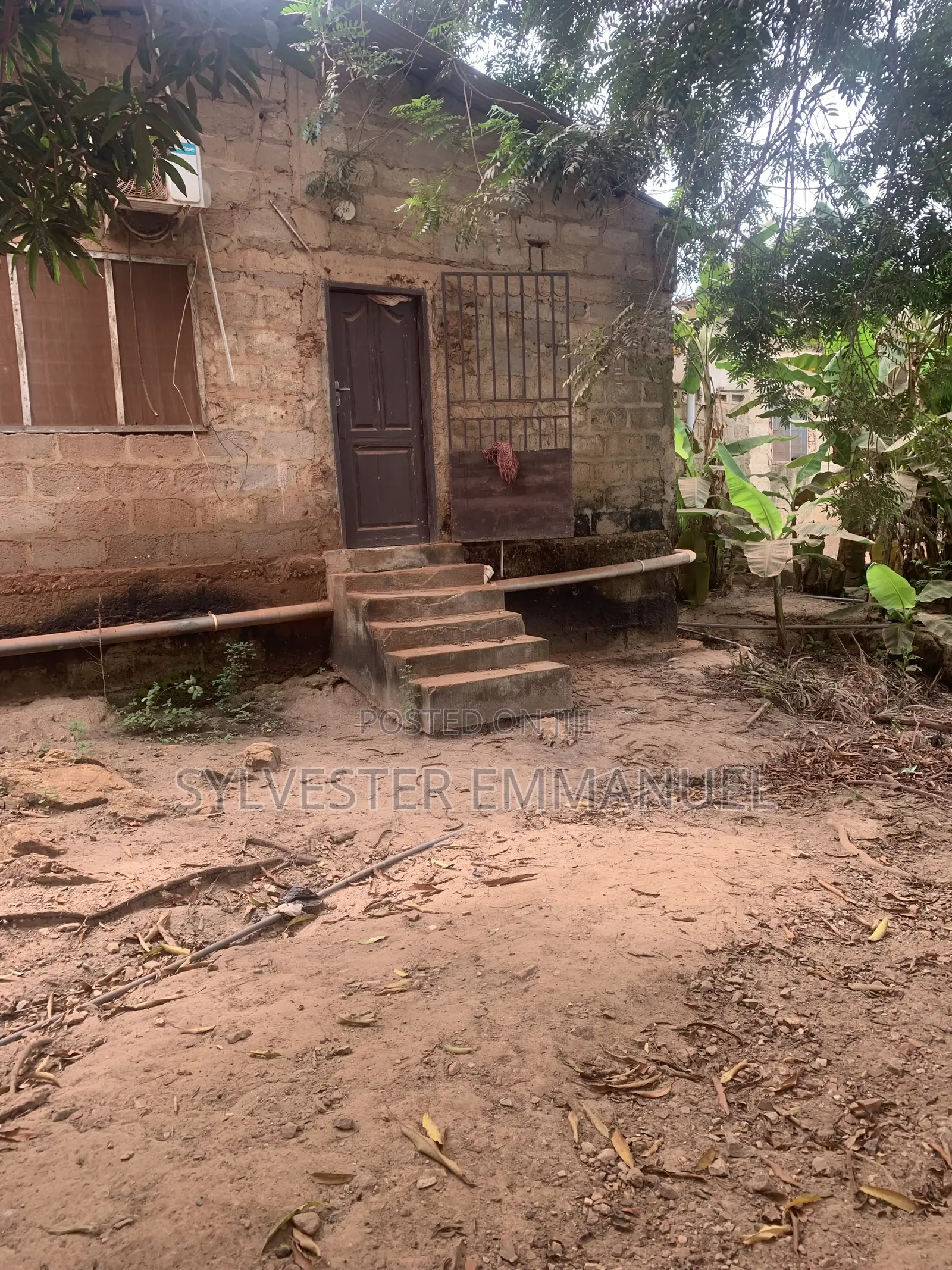 A Plot of Land (70/100 ) at Aplaku on a Roadside With a Building