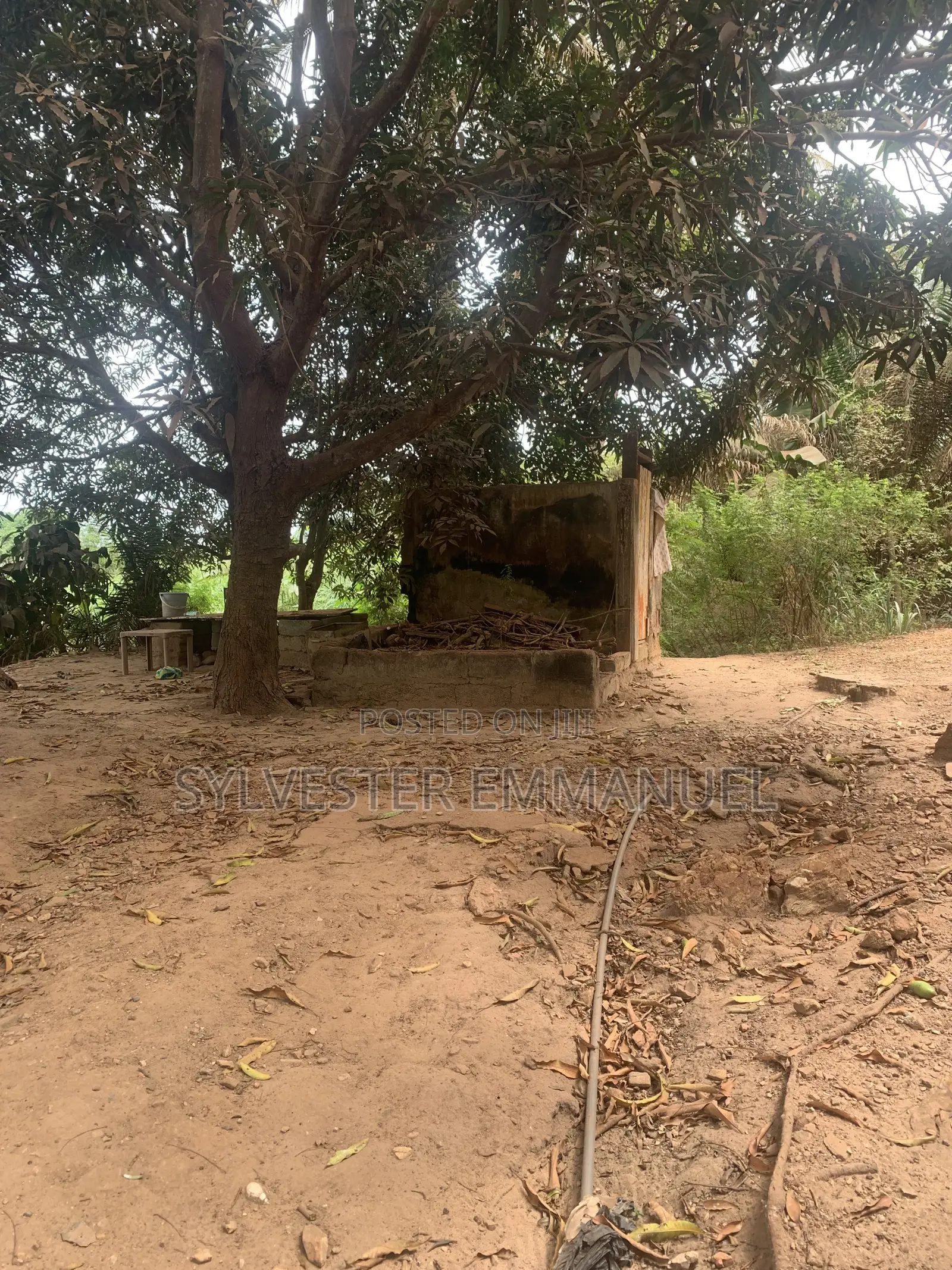 A Plot of Land (70/100 ) at Aplaku on a Roadside With a Building