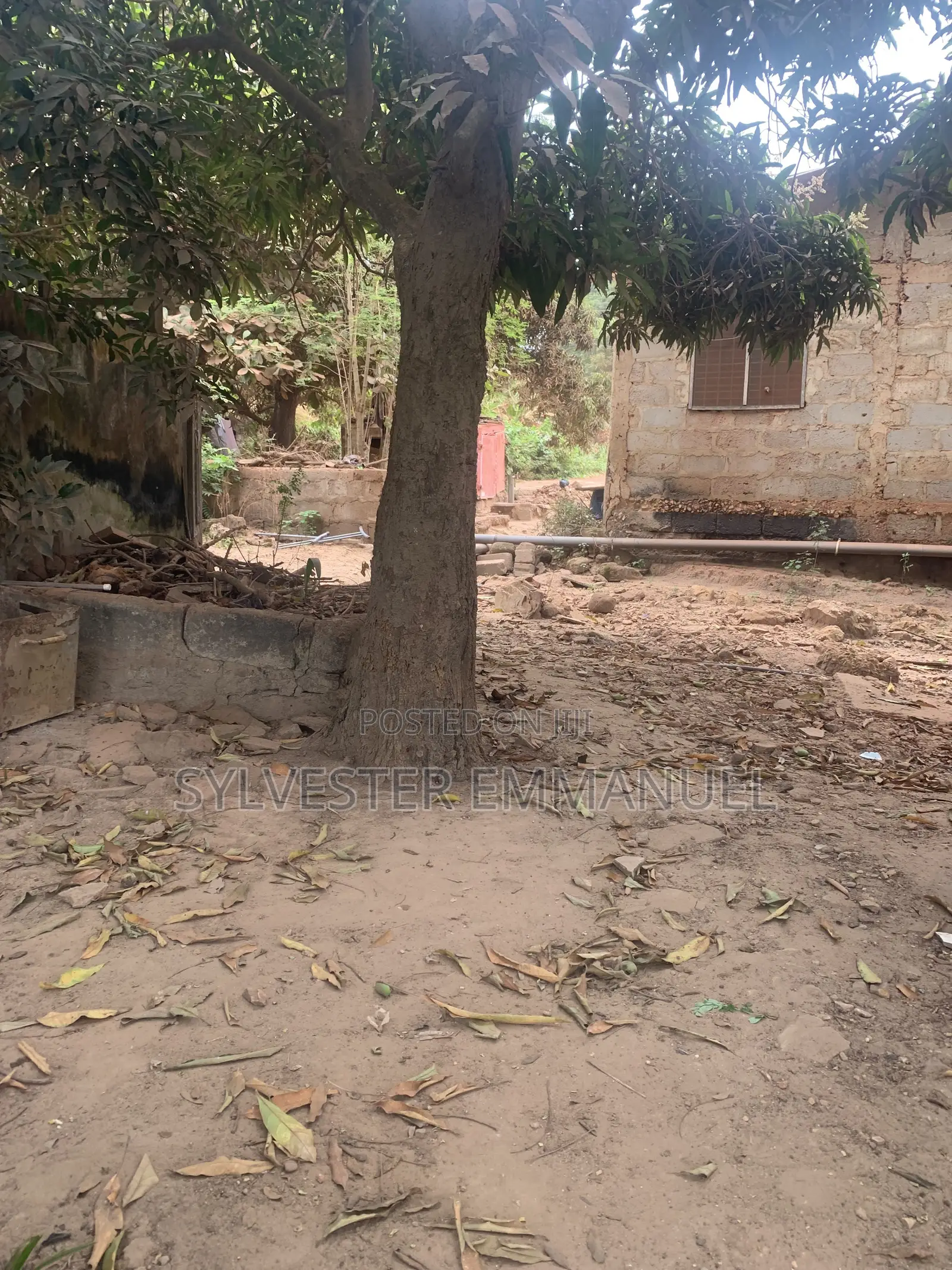 A Plot of Land (70/100 ) at Aplaku on a Roadside With a Building