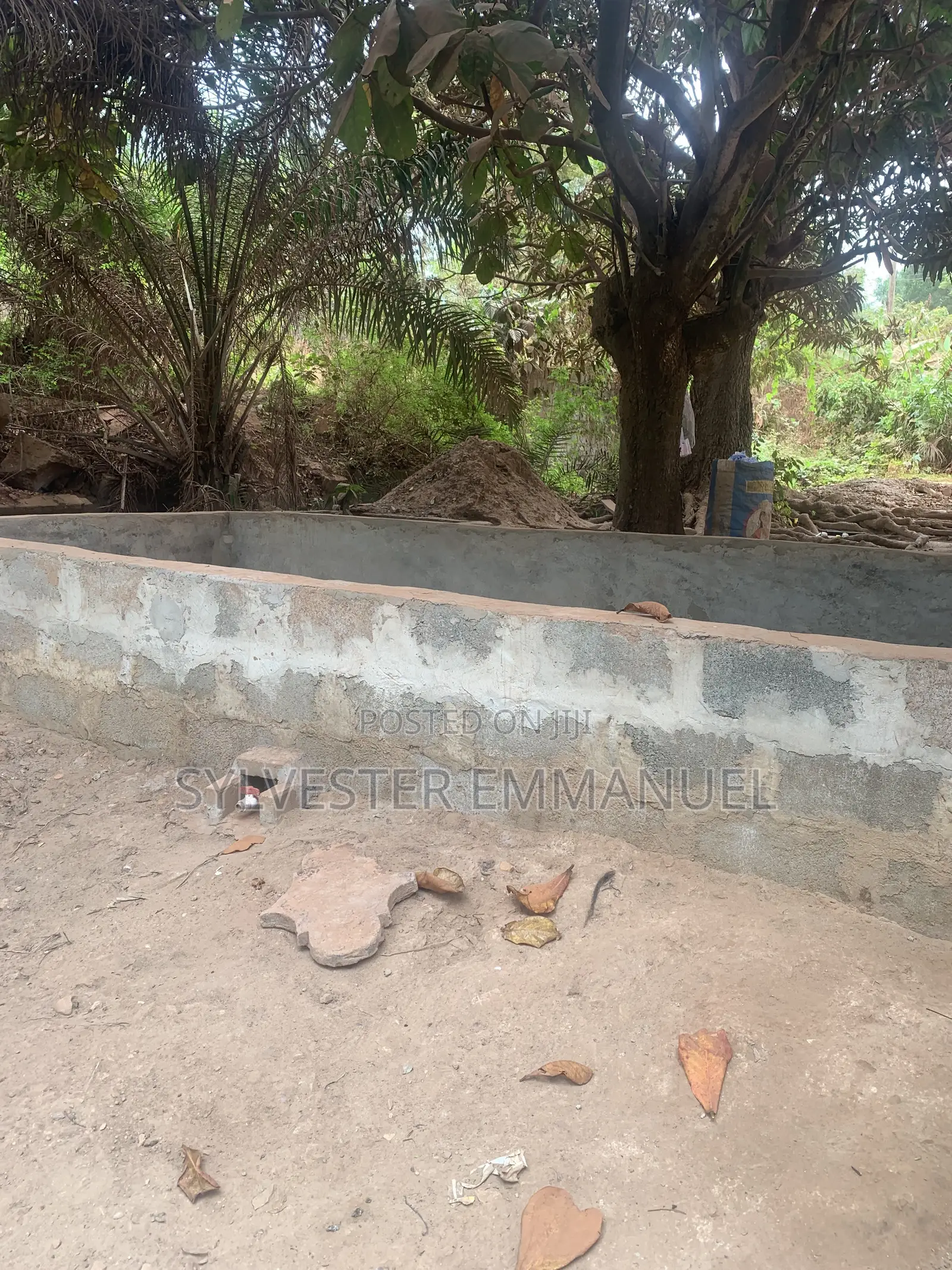 A Plot of Land (70/100 ) at Aplaku on a Roadside With a Building