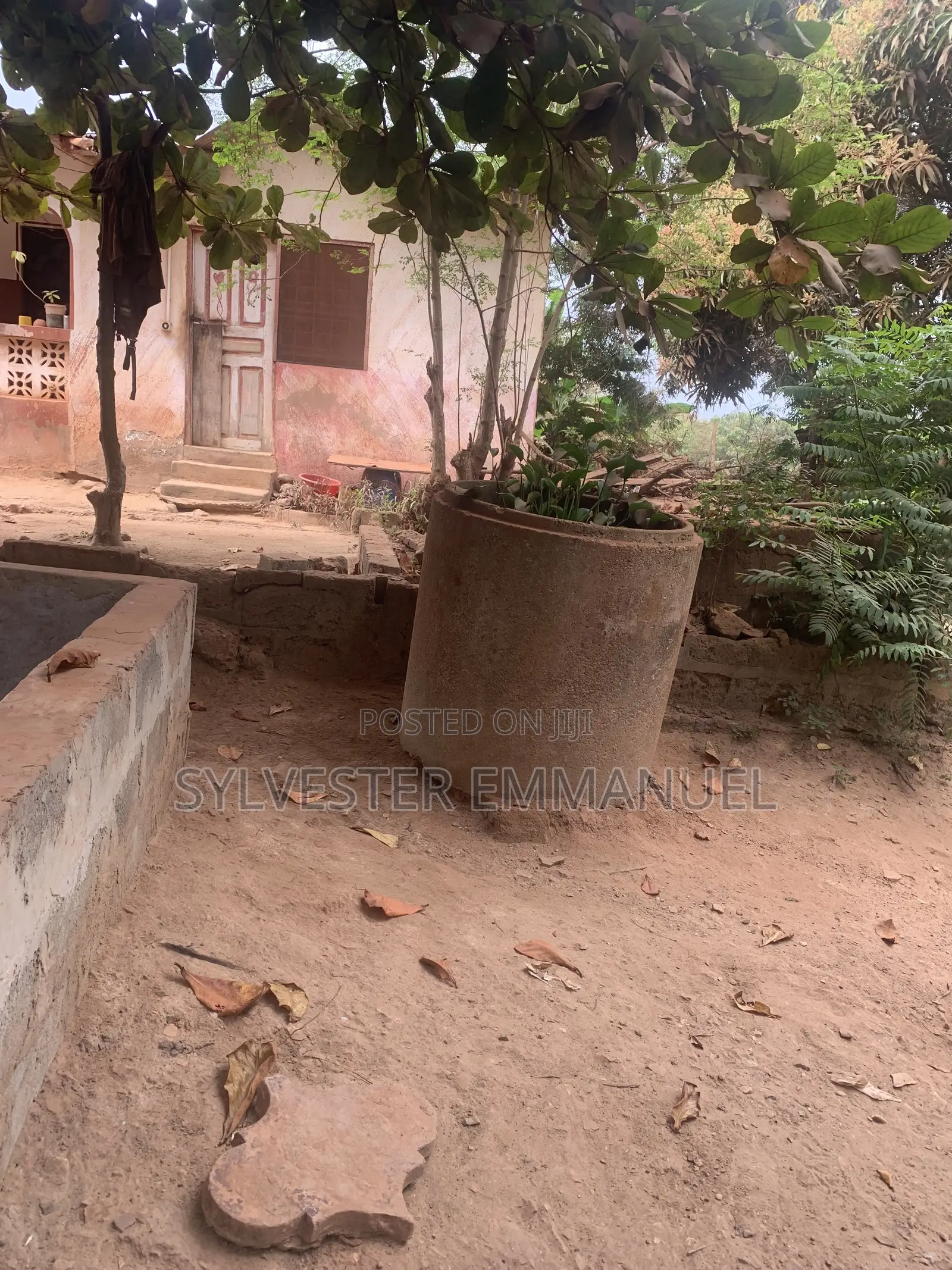 A Plot of Land (70/100 ) at Aplaku on a Roadside With a Building