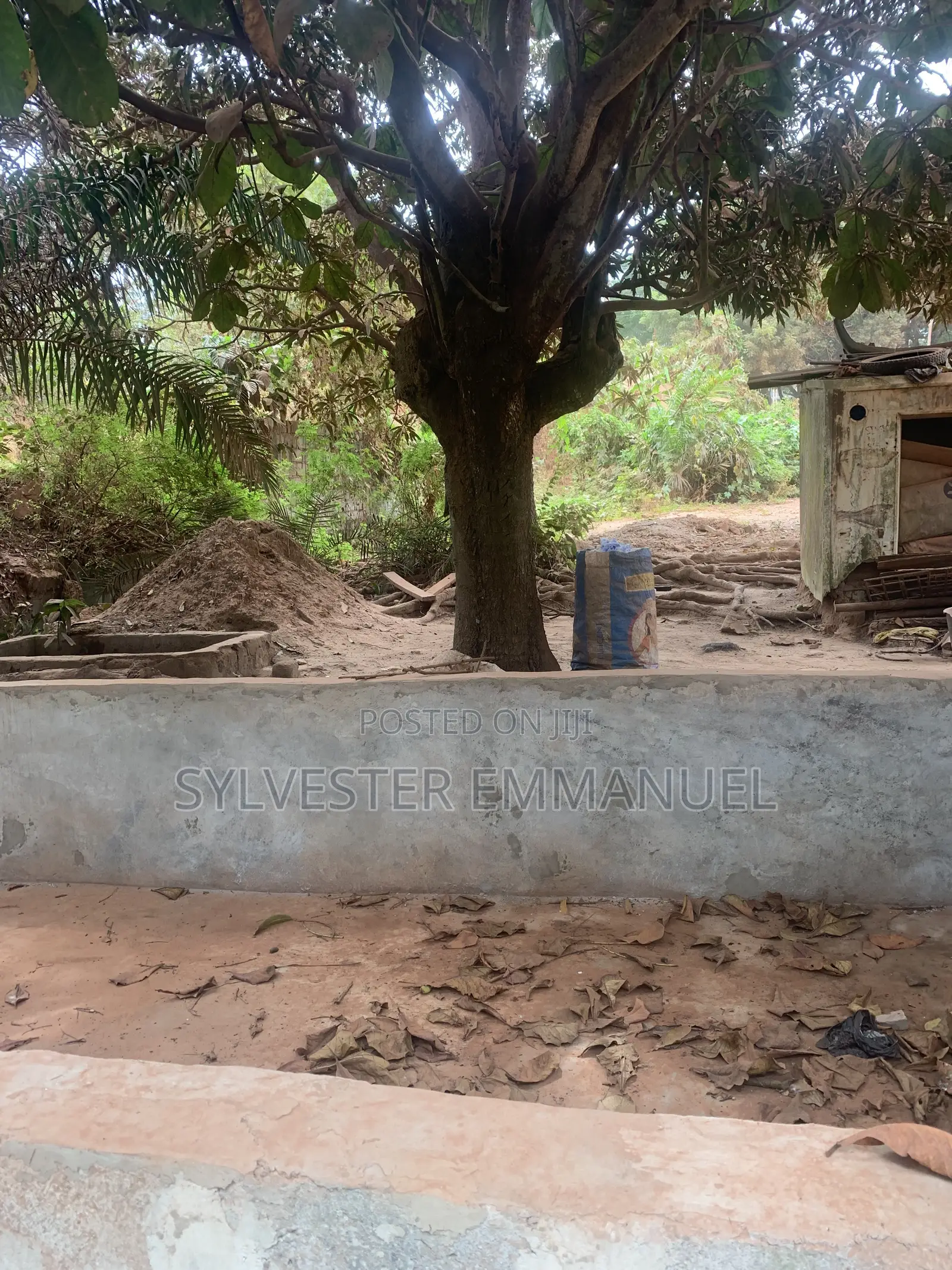 A Plot of Land (70/100 ) at Aplaku on a Roadside With a Building