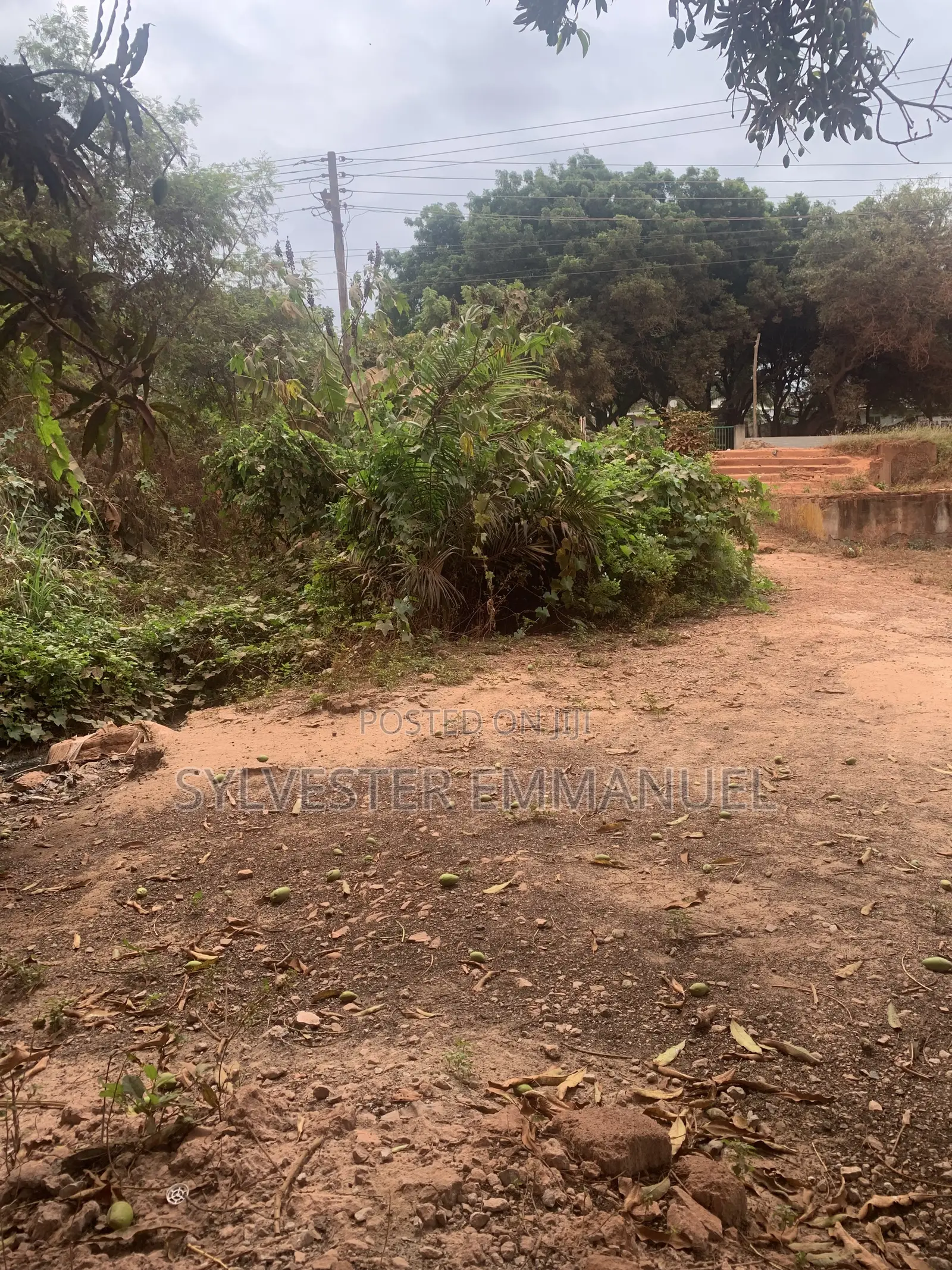 A Plot of Land (70/100 ) at Aplaku on a Roadside With a Building